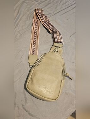 Anthropologie beige pebbled leather crossbody with gold logo tag